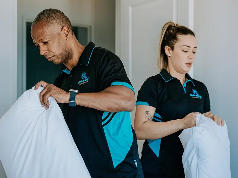 Ninja Hands team preparing fresh pillows and linen