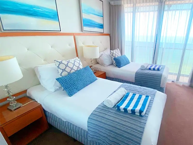 Freshly made bed in a holiday apartment