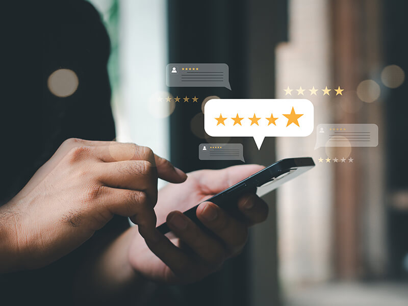 Person checking smartphone for customer reviews